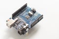 Programming board of Arduino UNO in blue colour isolated in white background Royalty Free Stock Photo