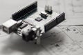 Programming board of Arduino UNO in blue colour isolated in white background Royalty Free Stock Photo
