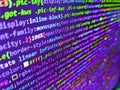 Programming code on computer monitor. Code on dark background. Abstract technology background. Young business crew working with Royalty Free Stock Photo