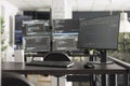 Programming code displayed on multiple computer monitors in office Royalty Free Stock Photo
