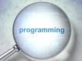 Programming concept: Programming with optical glass Royalty Free Stock Photo