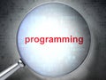 Programming concept: Programming with optical glass Royalty Free Stock Photo