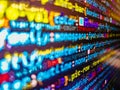 Programming on monitor background. Binary and source code malware background. Int. Writing program code on computer. Programming Royalty Free Stock Photo