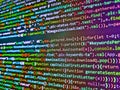 Programming text on dark screen. Digital computer code and black background. Website design. Programmer software workplace. Royalty Free Stock Photo