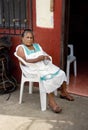 Progreso, Mexico - October 14, 2007: Poor old woman sitting in p