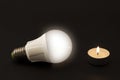 Progress of lighting with candle and LED bulb. Royalty Free Stock Photo