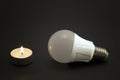 Progress of lighting with candle and LED bulb. Royalty Free Stock Photo