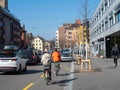 Zurich, Switzerland - March 5th 2022: Cyclists overtaking a traffic jam on a cycling trail