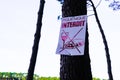 Prohibit picnic sign board on tree means in french text pique nique interdit Royalty Free Stock Photo