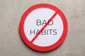 Prohibited symbol with text Bad habits on light grey stone background