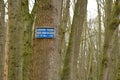 Prohibited to pass for unauthorized persons in Dutch on a tree