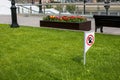 Prohibiting sign you can not walk with a dog on green lawn. Walking no animals Royalty Free Stock Photo