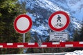 Prohibition of passage on wintry pass road with the notice: Closed due to avalanche danger