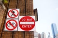 Prohibitive traffic sign on brick wall of street in New York City. No entry for people and bike Royalty Free Stock Photo