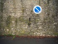 Prohibitory sign on an old weathered stone wall