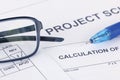 Project Calculation document with pen and eyeglasses Royalty Free Stock Photo