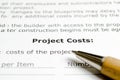 Project Costs with wooden pen