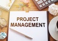 Project Management text written on office paper on office table. Business concept Royalty Free Stock Photo