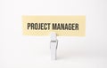 PROJECT MANAGER text on paper. On white background Royalty Free Stock Photo