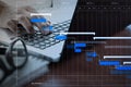 Close up of business man working on laptop computer on wooden de Royalty Free Stock Photo