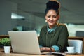 This project is my number one priority. Portrait of an attractive young woman working on her laptop in the office. Royalty Free Stock Photo