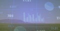 Projecting faint bar chart over grassy plain near horizon, showing pie chart, numeric labels Royalty Free Stock Photo