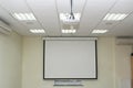 Projection screen in the boardroom Royalty Free Stock Photo