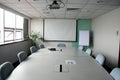 Projection screen in the boardroom Royalty Free Stock Photo