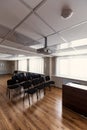 Projector hang on ceiling of empty sunlit meeting room Royalty Free Stock Photo