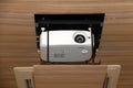 Projector hanging on meeting room ceiling Royalty Free Stock Photo