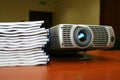 Projector with pile of books Royalty Free Stock Photo