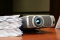 Projector with pile of books Royalty Free Stock Photo