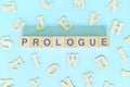 Prologue part of a book concept. Wooden blocks typography word flat lay Royalty Free Stock Photo