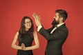 Prom party. Happy girl enjoy crowning. Bearded man crown beauty queen. Coronation party. Couple in love red background