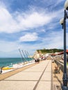 Promenade along urban beach in Etretat town