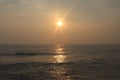 Promenade beach in Puducherry - sunrise - golden hues in sky - reflection in water - India tourism