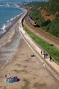 Promenade beteen Dawlish Warren and Dawlish town with train passing