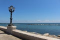 Promenade with brick wall and lamppost Royalty Free Stock Photo