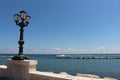 Promenade with brick wall and lamppost Royalty Free Stock Photo