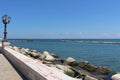 Promenade with brick wall and lamppost Royalty Free Stock Photo