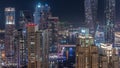 Promenade and canal in Dubai Marina with luxury skyscrapers around night timelapse, United Arab Emirates Royalty Free Stock Photo