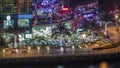 Promenade and canal in Dubai Marina with luxury skyscrapers and yachts around night timelapse, United Arab Emirates Royalty Free Stock Photo