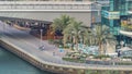 Promenade and canal in Dubai Marina with luxury skyscrapers and yachts around timelapse, United Arab Emirates Royalty Free Stock Photo