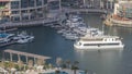 Promenade and canal in Dubai Marina with luxury skyscrapers and yachts around timelapse, United Arab Emirates Royalty Free Stock Photo