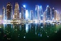 Promenade and canal in Dubai Marina at night with luxury skyscrapers around,United Arab Emirates Royalty Free Stock Photo