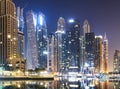 Promenade and canal in Dubai Marina at night with luxury skyscrapers around,United Arab Emirates Royalty Free Stock Photo