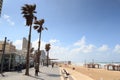 Promenade in city Tel Aviv with beach, urban skyscrapers and mediterranean sea, Israel