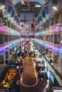 The Promenade deck of the big car ferry with cabin windows, people, restaurants and shops Royalty Free Stock Photo