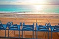 Promenade des Anglais waterfront of Nice benches looking at Mediterranean sunset Royalty Free Stock Photo