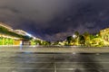 The promenade du Paillon of Nice France at night with the city in the distance.